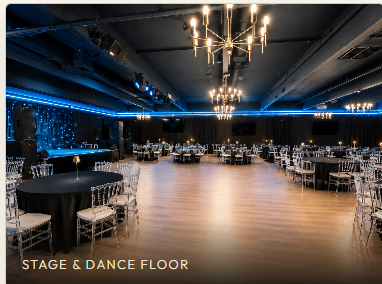 The stage and open dance floor under blue accent lighting