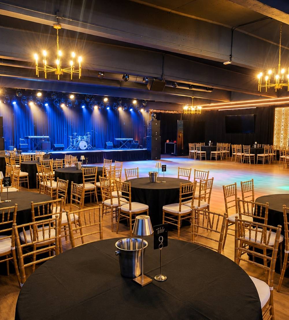 The main hall and lit stage at Crown Prince Event Hall